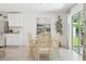 Bright dining area with modern decor and easy access to the outside patio through glass doors at 10401 Tucker Rd, Weeki Wachee, FL 34613