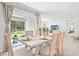 Well-lit dining area with a view of the backyard through sliding glass doors at 10401 Tucker Rd, Weeki Wachee, FL 34613
