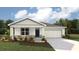 Charming single-Gathering home with a two-car garage and well-manicured lawn, blending modern design with a touch of traditional style at 10411 Tucker Rd, Weeki Wachee, FL 34613