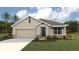 Charming single-story home featuring a two-car garage and beautiful stone accents at 10444 Tucker Rd, Weeki Wachee, FL 34613