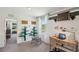 Bright office space with built-in shelves, desk, table, and backyard view at 10460 Tucker Rd, Weeki Wachee, FL 34613