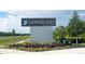 Community sign at Sandal Key, marking the entrance with attractive landscaping at 10466 Tucker Rd, Weeki Wachee, FL 34613