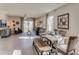 Open-concept living room and dining area with stylish furniture, decor, and ample natural light at 10466 Tucker Rd, Weeki Wachee, FL 34613