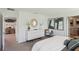 Stylish bedroom with a white dresser, modern decor, and a comfortable, inviting atmosphere at 10492 Tucker Rd, Weeki Wachee, FL 34613