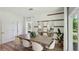 Elegant dining room with a large table and seating for eight, perfect for hosting dinner parties at 10492 Tucker Rd, Weeki Wachee, FL 34613