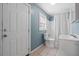 This bathroom features tile floors, a shower-tub combo with updated fixtures, and a matching commode and vanity at 304 Highland St, Brooksville, FL 34601