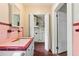 This pink bathroom includes a vintage sink, mirror, and tile details at 304 Highland St, Brooksville, FL 34601