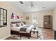 This staged bedroom features a bed, mirror, and storage cabinet at 304 Highland St, Brooksville, FL 34601