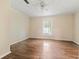 This is a bright bedroom with a large window and hardwood floors at 304 Highland St, Brooksville, FL 34601