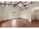 This is a bonus room with hardwood floors and an exposed beam ceiling at 304 Highland St, Brooksville, FL 34601