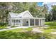 Charming one-story home with a covered porch and manicured lawn at 304 Highland St, Brooksville, FL 34601