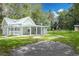 Charming one-story home with a covered porch and manicured lawn at 304 Highland St, Brooksville, FL 34601