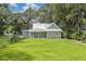 Charming one-story home featuring a well-maintained lawn and traditional architecture at 304 Highland St, Brooksville, FL 34601