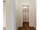 Hallway with wooden floors leads to a light filled closet space at 304 Highland St, Brooksville, FL 34601
