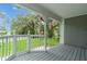 Front porch with view of well-manicured lawn and street at 304 Highland St, Brooksville, FL 34601