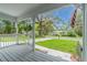 A pleasant covered porch with view of front yard at 304 Highland St, Brooksville, FL 34601