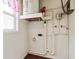 The utility room with a water heater and electrical panel at 304 Highland St, Brooksville, FL 34601