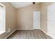 Vacant room features a single window and neutral paint, with wood-look flooring at 14150 Prospect St, Spring Hill, FL 34609