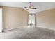 Spacious bedroom with a vaulted ceiling and large windows letting in natural light at 14150 Prospect St, Spring Hill, FL 34609