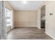 Open dining room with vinyl wood flooring and an adjacent kitchen at 14150 Prospect St, Spring Hill, FL 34609