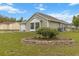 Well-maintained home with green siding, tidy landscaping, and an inviting yard at 14150 Prospect St, Spring Hill, FL 34609