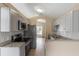 Bright kitchen features stainless steel appliances, granite countertops, and white subway tile backsplash at 14150 Prospect St, Spring Hill, FL 34609