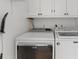 A laundry room featuring a side-by-side washer and dryer at 14150 Prospect St, Spring Hill, FL 34609