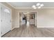 Open-concept living room with wood floors, flowing seamlessly into the kitchen and dining areas at 14150 Prospect St, Spring Hill, FL 34609