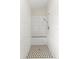 White tiled shower with gray and white mosaic tile floor and a built-in bench at 14150 Prospect St, Spring Hill, FL 34609
