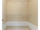 Walk-in closet with shelving, baseboard trim, and a door at 14150 Prospect St, Spring Hill, FL 34609