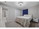 Comfortable bedroom featuring a closet, carpet, and an en-suite bathroom with shower at 14347 Easy Goer St, Ruskin, FL 33573