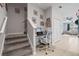 Inviting hallway featuring a built-in desk, carpeted stairs, and access to the spacious living area at 14347 Easy Goer St, Ruskin, FL 33573