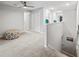 Open loft area with neutral carpeting, perfect for relaxing or entertaining guests upstairs at 14347 Easy Goer St, Ruskin, FL 33573