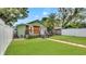 Lush backyard with green grass, exterior stairs, and well-maintained landscaping for outdoor enjoyment at 2715 14Th N Ave, St Petersburg, FL 33713