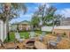 Inviting backyard features a fire pit, hot tub, and a charming, well-maintained green home at 2715 14Th N Ave, St Petersburg, FL 33713