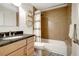 Bathroom showcasing stylish vanity, shower with tan subway tile and decorative shelf at 2715 14Th N Ave, St Petersburg, FL 33713