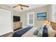 Cozy bedroom with a dresser, TV, closet, and a soothing color palette for relaxation at 2715 14Th N Ave, St Petersburg, FL 33713