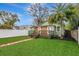 Charming home with well-manicured artificial lawn, wooden deck and white picket fence at 2715 14Th N Ave, St Petersburg, FL 33713