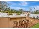 Outdoor hot tub features bar top seating with four stools on a pea gravel base at 2715 14Th N Ave, St Petersburg, FL 33713