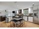 Modern kitchen with stainless appliances, granite counters, and an open view to the living room at 2715 14Th N Ave, St Petersburg, FL 33713