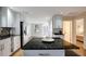 Bright kitchen featuring white cabinetry, granite counters and stainless appliances at 2715 14Th N Ave, St Petersburg, FL 33713