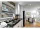 Kitchen features white cabinets, granite counters and stainless steel appliances at 2715 14Th N Ave, St Petersburg, FL 33713