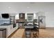 Bright modern kitchen features stainless appliances, granite counters and hardwood flooring at 2715 14Th N Ave, St Petersburg, FL 33713