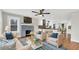 Open concept living room flows into a kitchen with modern appliances and a fireplace feature at 2715 14Th N Ave, St Petersburg, FL 33713