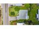 Aerial view highlighting a home with a pristine roof, landscaped yard, and convenient access to nearby street at 1137 Indian Rocks S Rd, Largo, FL 33770