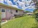 Well-maintained backyard with lush green lawn and views of a screened patio at 1137 Indian Rocks S Rd, Largo, FL 33770