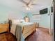 Bedroom with natural wood furniture, soft carpet, and two windows for natural light at 1137 Indian Rocks S Rd, Largo, FL 33770
