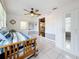 Bright bedroom featuring tile flooring, a ceiling fan, and a closet with mirrored doors at 1137 Indian Rocks S Rd, Largo, FL 33770