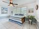Bedroom with tile flooring, bright windows, and tasteful artwork creates a peaceful retreat at 1137 Indian Rocks S Rd, Largo, FL 33770
