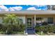 Inviting home entrance with lush landscaping, a welcoming walkway, and a charming front door at 1137 Indian Rocks S Rd, Largo, FL 33770